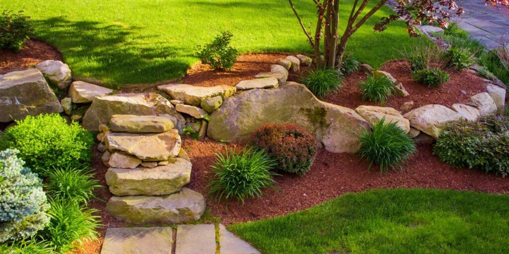 Stone pathway and staircase leading to beautiful lawn
